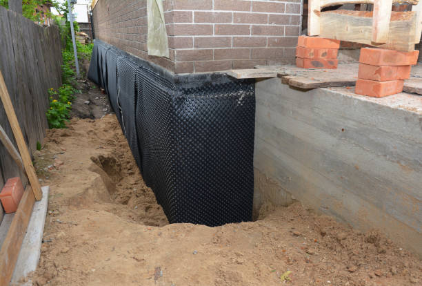 SJ Waterproofing Pros technician performing targeted Wet Basement Repair assessment in Hopewell, TN